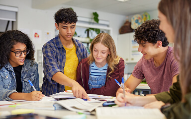 Students working together at a table.